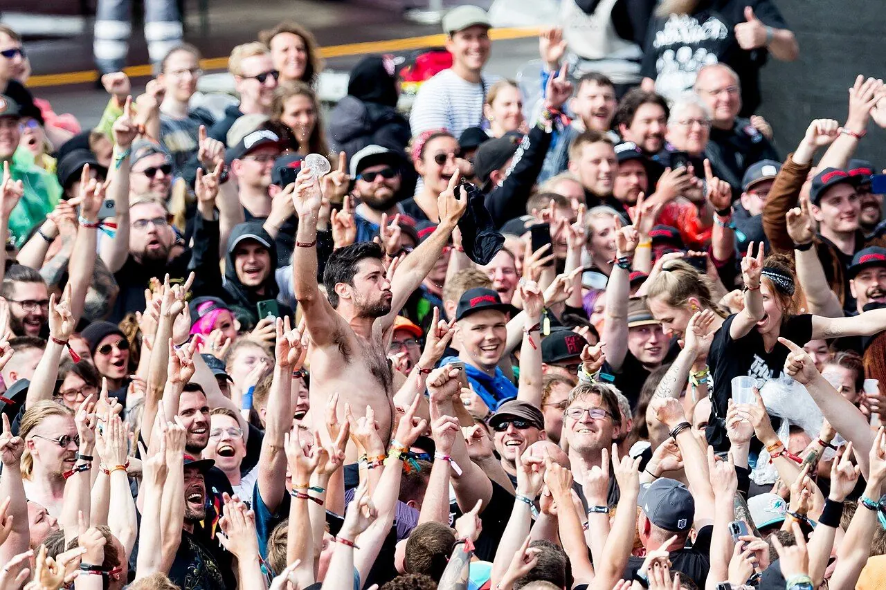 Lone concertgoer watching a band from the crowd