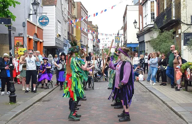 Morris dancers performing in a historic English high street