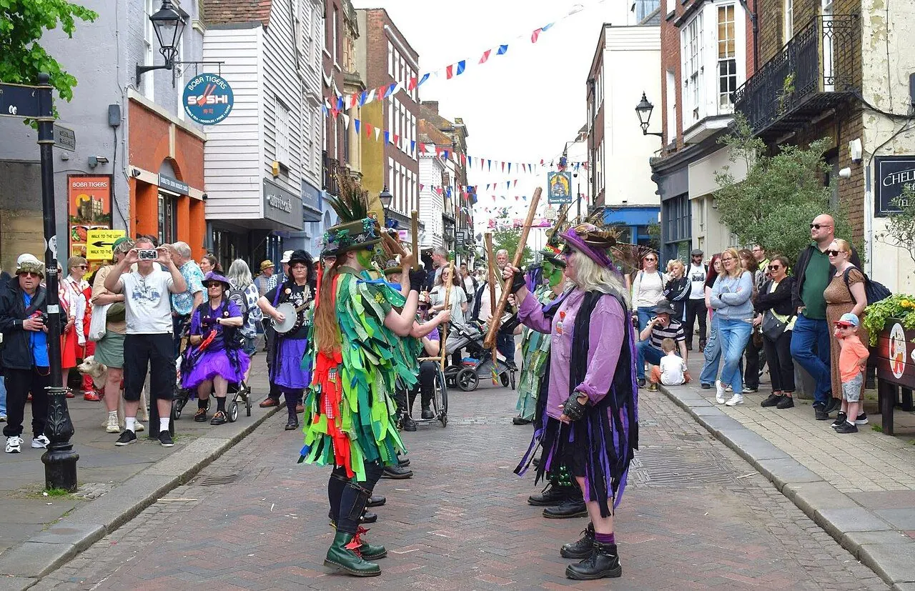 Morris dancers performing in a historic English high street